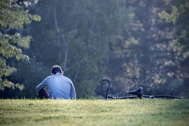 boy alone with a bicycle