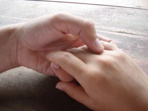 couple touching hands