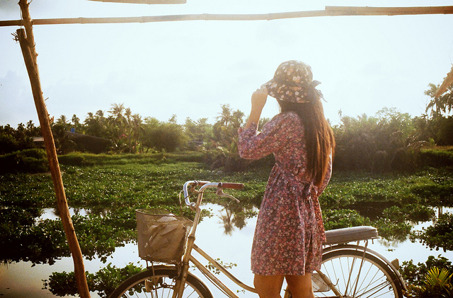girl with a bicycle in morning